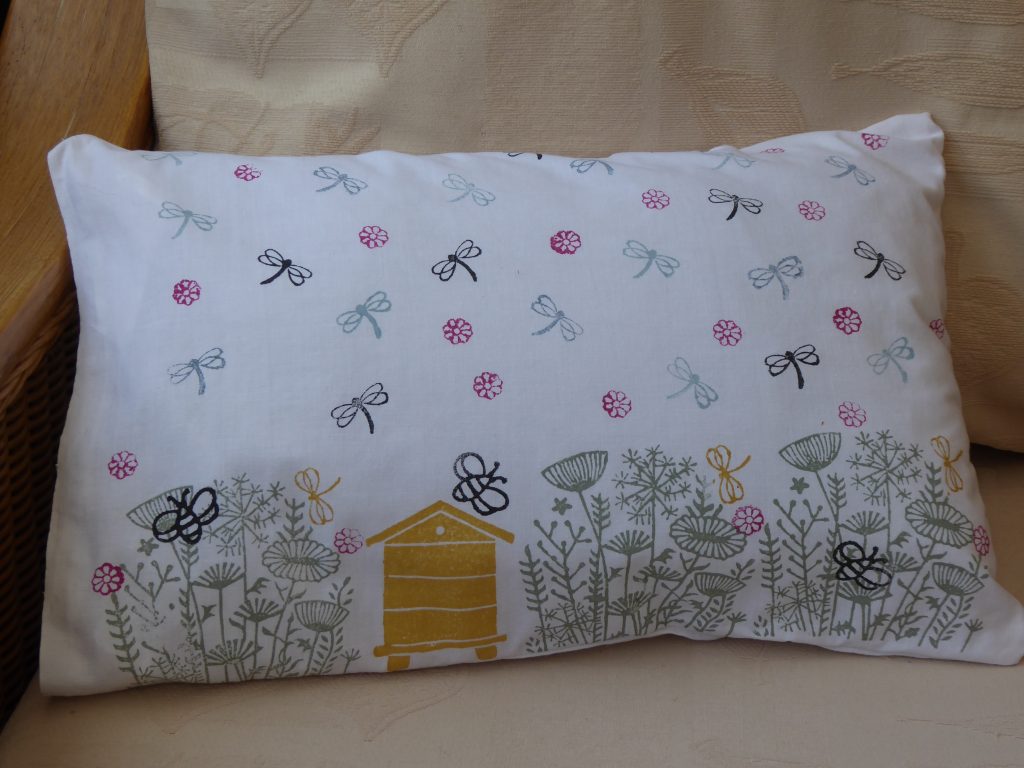 Picture of a block printed cushion with Bees